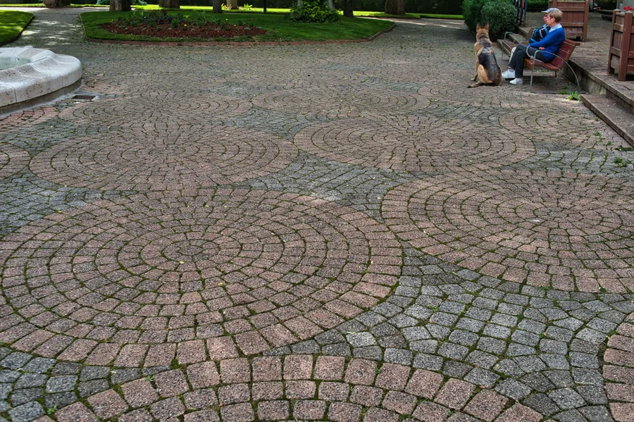 Cobblestone pavers laid in a circular fan pattern